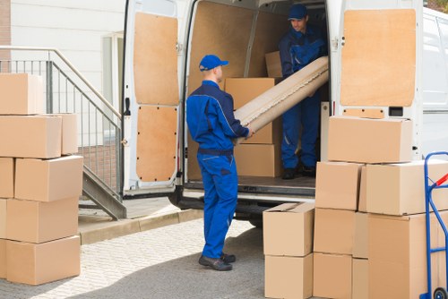 Professional movers handling a large moving truck