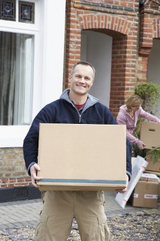 Professional movers packing household items