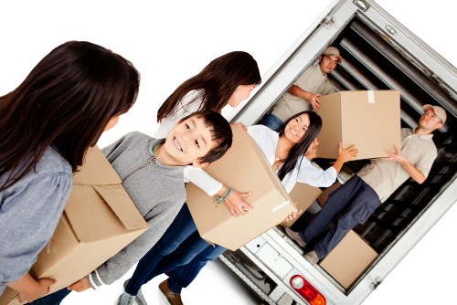 Removal truck being loaded with household items