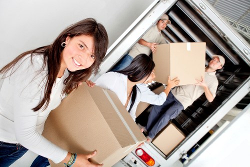 Professional movers handling furniture