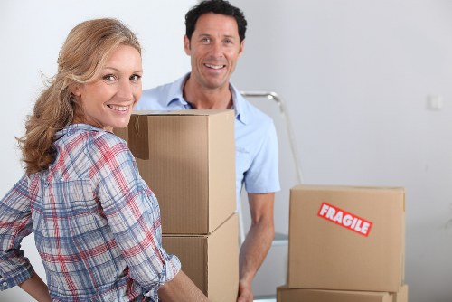 Professional mover handling furniture with a van