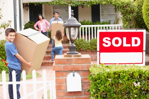 Professional movers handling office equipment